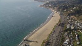 5K aerial stock footage tilt from bird's eye view of Highway 1 and beach by Pacific Palisades, California Aerial Stock Footage | DCLA_133
