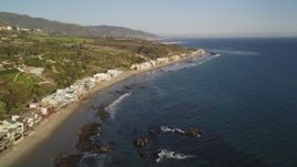 5K aerial stock footage of passing a row of oceanfront homes in Malibu, California Aerial Stock Footage | DCLA_168