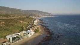 5K aerial stock footage flyby a row of homes on the beach in Malibu, California Aerial Stock Footage | DCLA_169