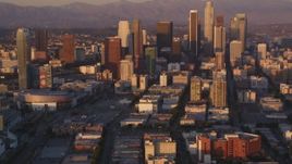 5K stock footage video tilt to reveal and approach Downtown Los Angeles skyscrapers at sunset, California Aerial Stock Footage | DCLA_210