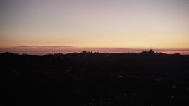 5K aerial stock footage of lights of homes on the Hollywood Hills at twilight, California Aerial Stock Footage | DCLA_287