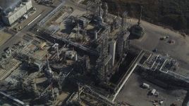 5K aerial stock footage Tilt to bird's eye of flare stacks and structures at Phillips 66 Company Santa Maria Refinery, Arroyo Grande, California Aerial Stock Footage | DCSF02_007