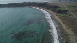 5K aerial stock footage Fly over William Randolph Hearst Memorial State Beach to approach San Simeon Pier, San Simeon, California Aerial Stock Footage | DCSF03_017