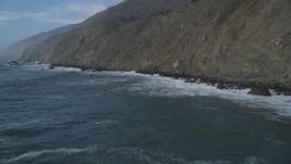 5K aerial stock footage Fly low and pan across ocean waves crashing into cliffs, San Simeon, California Aerial Stock Footage | DCSF03_026