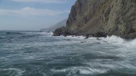 5K aerial stock footage Fly low altitude over ocean waves, rocks, by coastal cliffs, San Simeon, California Aerial Stock Footage | DCSF03_031