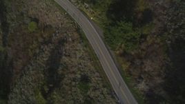 5K aerial stock footage Bird's eye view of Highway 1 winding past hills, Big Sur, California Aerial Stock Footage | DCSF03_035