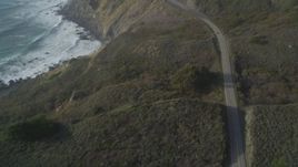 5K aerial stock footage Tilt from bird's eye of Highway 1 above the coastline, Big Sur, California Aerial Stock Footage | DCSF03_037