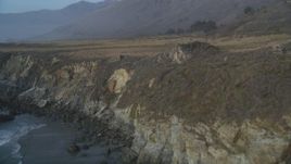 5K aerial stock footage Fly by coastal cliffs and tilt to reveal ocean rocks, Big Sur, California Aerial Stock Footage | DCSF03_041