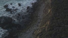 5K aerial stock footage Bird's eye view of waves slamming into coastal rock formations, Big Sur, California Aerial Stock Footage | DCSF03_042