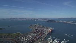 5K aerial stock footage Fly over the Port of Oakland to approach the Bay Bridge and San Francisco Bay, California Aerial Stock Footage | DCSF05_005