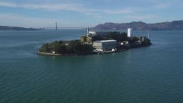 5K aerial stock footage Tilt from low flight over San Francisco Bay, revealing Alcatraz, Golden Gate Bridge, California Aerial Stock Footage | DCSF05_071