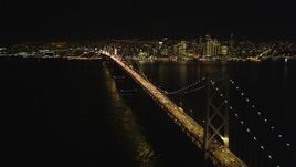 5K aerial stock footage Approach heavy traffic on the upper deck of the Bay Bridge, Downtown San Francisco skyline in background, California, night Aerial Stock Footage | DCSF06_032