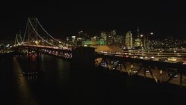 5K aerial stock footage Flying by Bay Bridge, focus on San Francisco skyline, California, night Aerial Stock Footage | DCSF06_035