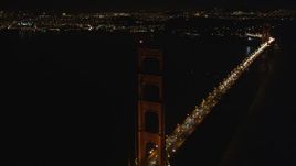 5K aerial stock footage Tilt from light traffic to tower of Golden Gate Bridge, San Francisco, California, night Aerial Stock Footage | DCSF06_043