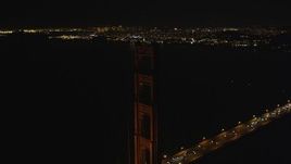 5K aerial stock footage Flying by one of the Golden Gate Bridge towers, San Francisco, California, night Aerial Stock Footage | DCSF06_044