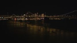 5K aerial stock footage Fly away from Bay Bridge and the downtown skyline, San Francisco, California, night Aerial Stock Footage | DCSF06_088