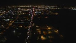5K aerial stock footage Follow Interstate 880 and approach O.co Coliseum, Oracle Arena, Oakland, California, night Aerial Stock Footage | DCSF06_099