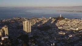 5K aerial stock footage of A view of Coit Tower while flying by Russian Hill high-rises, San Francisco, California, sunset Aerial Stock Footage | DCSF07_006