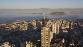 5K aerial stock footage of Coit Tower seen while flying by Russian Hill high-rises, San Francisco, California, sunset Aerial Stock Footage | DCSF07_007
