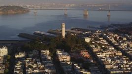 5K aerial stock footage Approach Coit Tower with Bay Bridge in background, North Beach, San Francisco, California, sunset Aerial Stock Footage | DCSF07_008