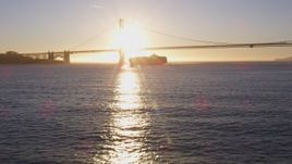 5K aerial stock footage Low approach to a cargo ship near Golden Gate Bridge, San Francisco, California, sunset Aerial Stock Footage | DCSF07_036