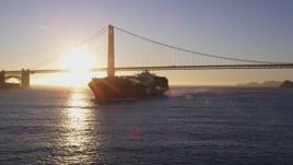 5K aerial stock footage Low altitude flyby of a cargo ship near the Golden Gate Bridge, San Francisco, California, sunset Aerial Stock Footage | DCSF07_037