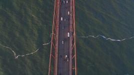 5K aerial stock footage Bird's eye view of traffic on the Golden Gate Bridge, San Francisco, California, sunset Aerial Stock Footage | DCSF07_040
