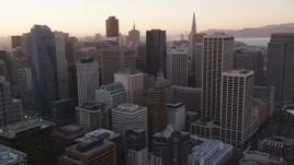 5K Aerial Video Flying by high-rises and skyscrapers, Downtown San Francisco, California, sunset Aerial Stock Footage | DCSF07_062