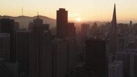 5K Aerial Video Flying skyscrapers, setting sun in background, Downtown San Francisco, California, sunset Aerial Stock Footage | DCSF07_066
