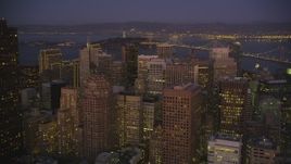 5K Aerial Video Fly over skyscrapers to approach the Bay Bridge, Downtown San Francisco, California, night Aerial Stock Footage | DCSF07_093