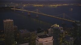 5K Aerial Video Approach and tilt to the Bay Bridge from Downtown San Francisco, California, night Aerial Stock Footage | DCSF07_094