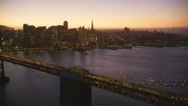 5K Aerial Video Reverse view of Bay Bridge and Downtown San Francisco skyline, California, twilight Aerial Stock Footage | DCSF07_099
