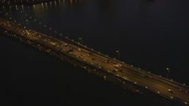 5K Aerial Video Flying by heavy traffic on the Bay Bridge, San Francisco, California, night Aerial Stock Footage | DCSF07_103