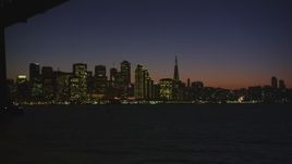 5K Aerial Video view of Downtown San Francisco, reveal and fly under the Bay Bridge, California, night Aerial Stock Footage | DCSF07_119