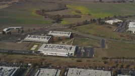 5K Aerial Video Reverse view of business park office buildings in Newark, California Aerial Stock Footage | DCSF08_007