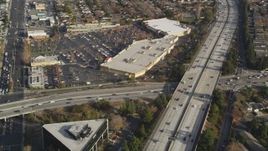 5K Aerial Video Reverse view of neighborhoods beside Interstate 280, reveal shopping center, San Jose, California Aerial Stock Footage | DCSF09_012