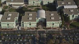 5K Aerial Video Fly over parking lots and reveal Apple Headquarters, tilt to bird's eye view, Cupertino, California Aerial Stock Footage | DCSF09_016