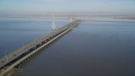 5K Aerial Video Tilt from wetlands to reveal San Francisco Bay and Dumbarton Bridge, California Aerial Stock Footage | DCSF09_025