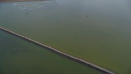 5K Aerial Video of A reverse view of wetlands in Union City, California Aerial Stock Footage | DCSF09_030