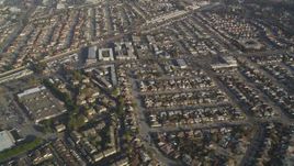 5K Aerial Video Reverse view of residential neighborhoods and shopping centers, San Leandro, California Aerial Stock Footage | DCSF09_035