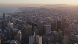 5K Aerial Video Tilt from city streets and fly over Financial District toward South of Market, San Francisco, California, twilight Aerial Stock Footage | DCSF10_011