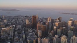 5K Aerial Video Pan across Downtown San Francisco, California, sunset, with views of San Francisco Bay and Bay Bridge Aerial Stock Footage | DCSF10_012