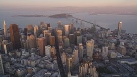 5K Aerial Video Reverse view of Downtown San Francisco, California, sunset, pan across cityscape Aerial Stock Footage | DCSF10_013