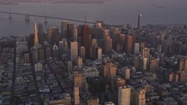 5K Aerial Video Flyby Downtown San Francisco, California, twilight, Bay Bridge in the background Aerial Stock Footage | DCSF10_015