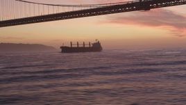 5K Aerial Video Track oil Tanker approaching Golden Gate Bridge, San Francisco, California, twilight Aerial Stock Footage | DCSF10_043
