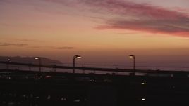 5K Aerial Video Tracking cars on the Golden Gate Bridge, and fly away to a wider view, San Francisco, California, twilight Aerial Stock Footage | DCSF10_049