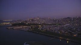 5K Aerial Video Flyby marina and Fort Mason, downtown skyline in the background, San Francisco, California, twilight Aerial Stock Footage | DCSF10_054
