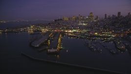 5K Aerial Video Flyby Fisherman's Wharf, downtown skyline in the background, San Francisco, California, twilight Aerial Stock Footage | DCSF10_055
