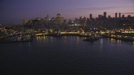 5K Aerial Video Flyby Fisherman's Wharf and downtown skyline, reveal Pier 39, North Beach, San Francisco, California, twilight Aerial Stock Footage | DCSF10_056