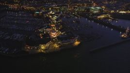 5K Aerial Video Tilt to a bird's eye view of Pier 39, decorated for Christmas, San Francisco, California, night  Aerial Stock Footage | DCSF10_059
